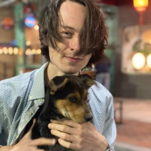 picture of Ales Varabyou holding a dog.