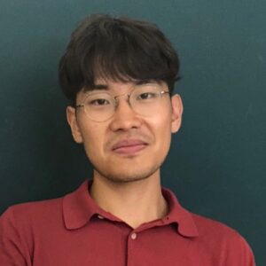 Square-framed headshot of Yongju Lee, PhD, in red collared shirt and glasses.